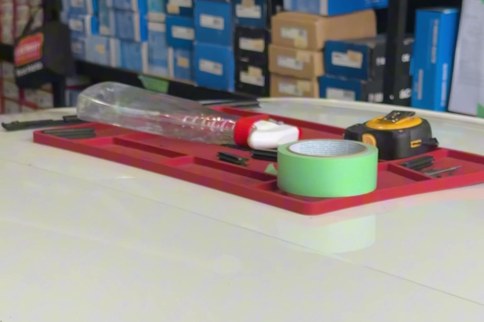 Tools laid out on a red jig on a vehicle roof during a Roof Rack Centre fitting